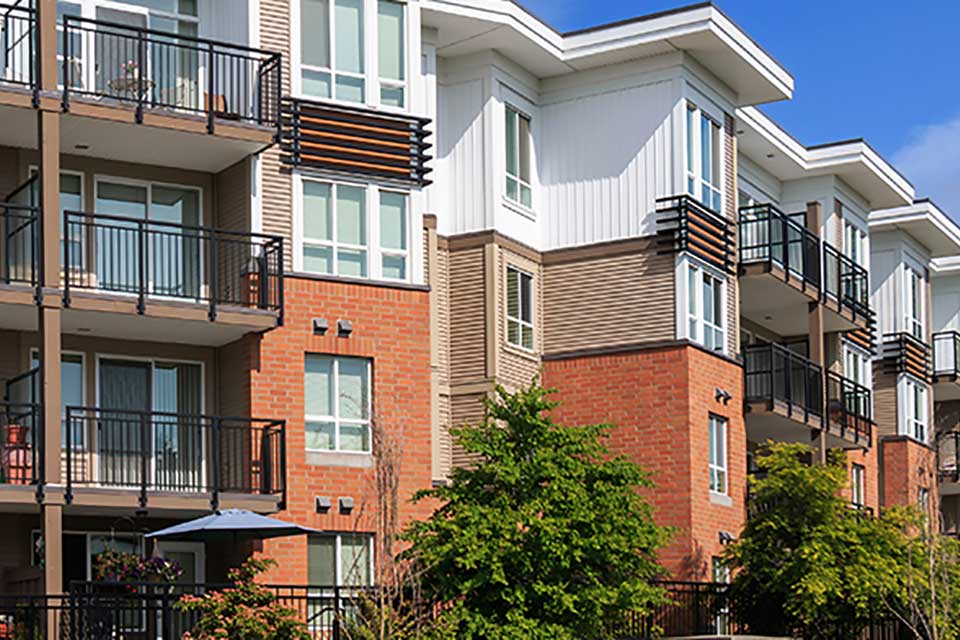 Modern townhouse and condo buildings highlighting homeowners and townhouse insurance coverage